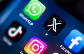 mobile phone screen close up view focusing on the twitter now x icon