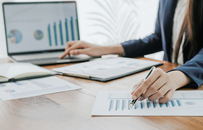 Business concept. Business people discussing the charts and graphs showing the results of their successful teamwork.
