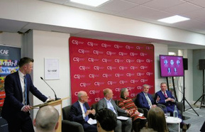A panel of six engaging in a discussion at the Centre for Social Justice