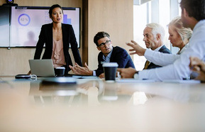 Diverse group of trustees having a meeting in boardroom