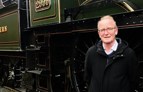 Clive Hetherington in front of a steam train