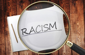 Racism word under microscope 440.jpg