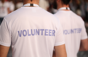 People in T-shirts with the inscription 'Volunteer'
