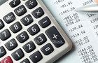 Financial balance sheet with a calculator