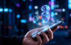Stock image of an AI chatbot on a handheld phone