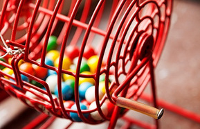 Red raffle game with different colored balls for bingo and lottery games