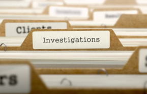 Investigations concept with word on folder