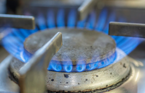 Gas flame burning on kitchen hob