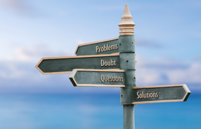 problems doubt questions solutions four word quote written on fancy steel signpost outdoors by the sea. Soft Blue ocean bokeh background