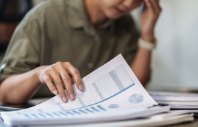 Business woman overworking and headache stressed in office.
