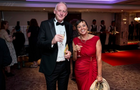 Chris and Julie Parsons smiling to camera at the drinks reception 