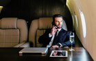 Businessman flying on his private jet