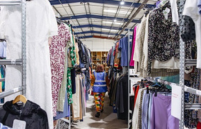 Clothes hanging in Oxfam Batley warehouse