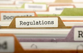 Regulations concept with word on folder.