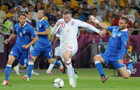 De_Rossi_tackle_on_Rooney_England-Italy_Euro_2012 credit Football.ua CC3.0 440.jpg