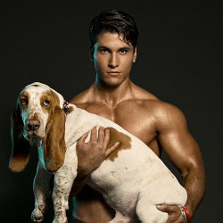 bloke_holding_sad_dog_250.jpg